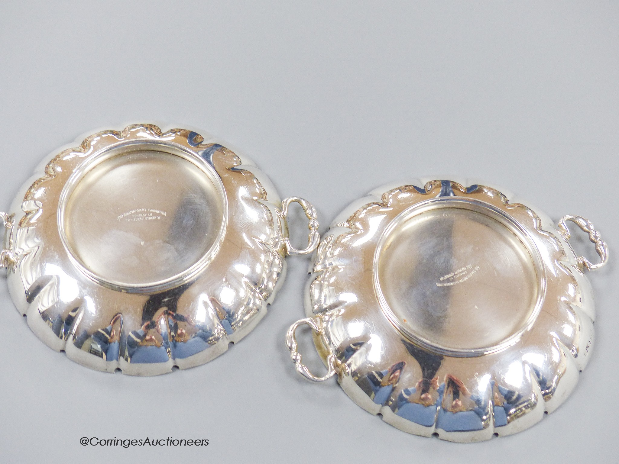 A pair of 1930's silver two handled shallow dishes, Goldsmiths & Silversmiths Co Ltd, London, 1937, 14.2cm, 8.5oz.
